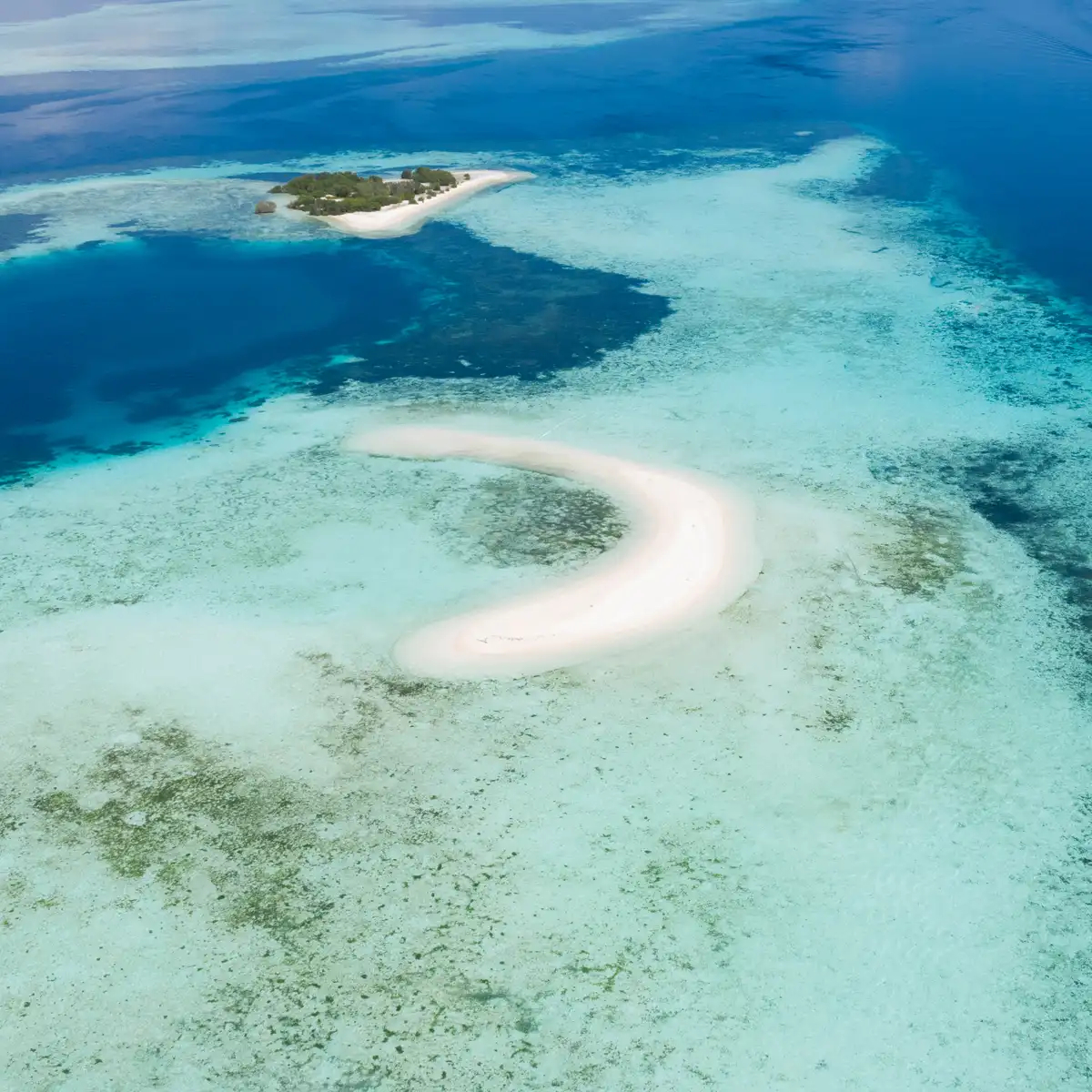 The crescent sandbar of Taka Makassar
